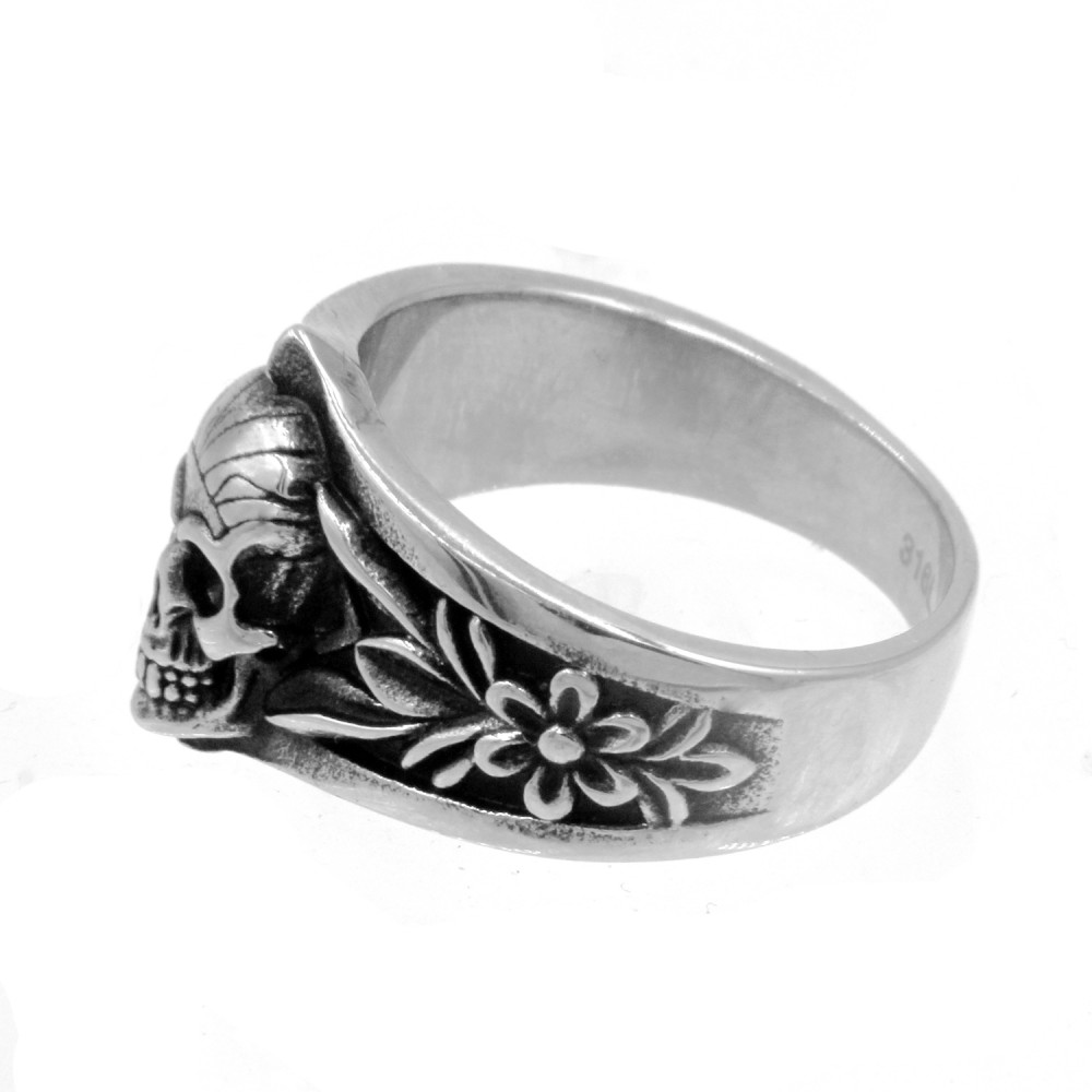 Skull ring surrounded by flowers